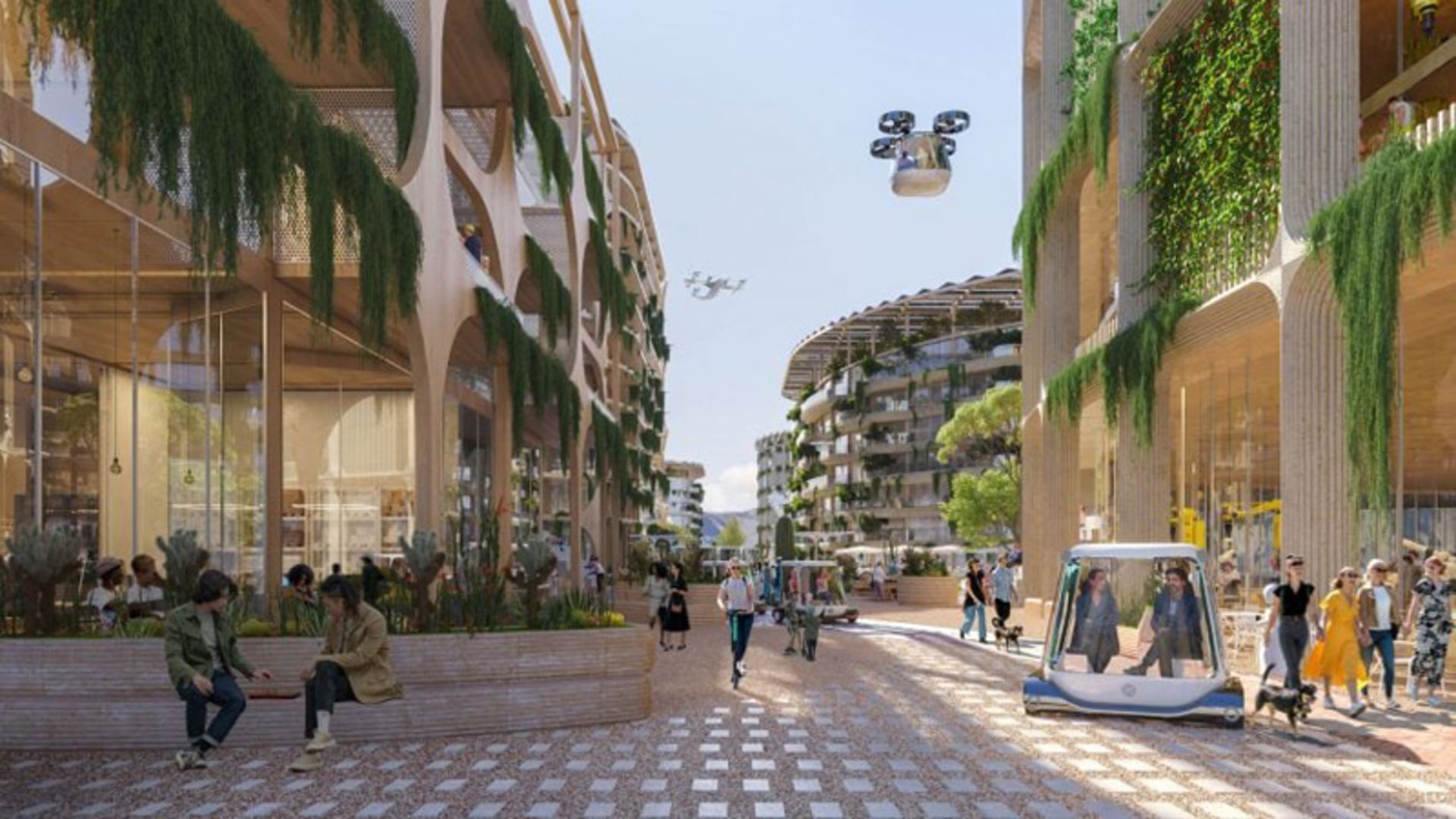 مردم در خیابان های شهر تلوسا با سازه های پوشیده از گیاه سبز